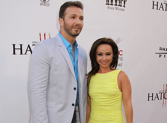 Danielle Harris with her husband, David Gross during an event