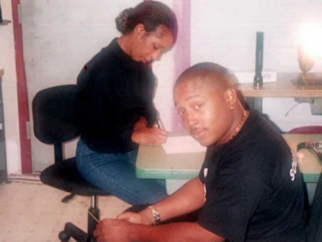 Daymond John and his mom in the 90's