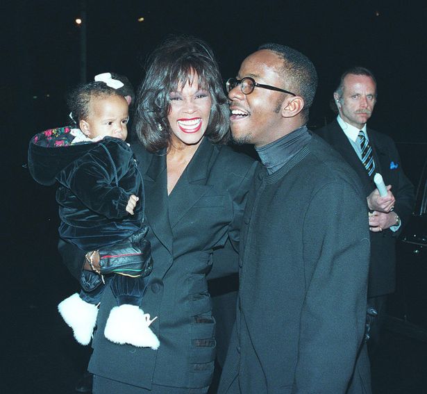 Whitney Houston and Bobby Brown with their daughter Bobbi Kristina in 1994